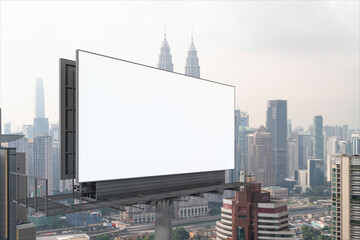 Blank white road billboard with KL cityscape background at day time. Street advertising poster, mock up, 3D rendering. Side view. The concept of marketing communication to promote or sell idea.