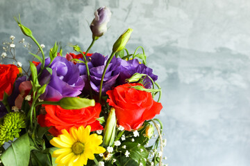 multicolored roses and eustomas in a bouquet close-up 