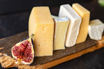 cheese assortment different types of hard and soft cheeses serving size raw natural milk top view copy space for text