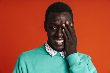 Happy african man wearing casual clothing laughing