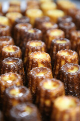 Custard deserts being cooked in a professional kitchen.