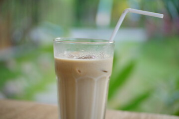 Close up of ice coffee milk on a cafe table.