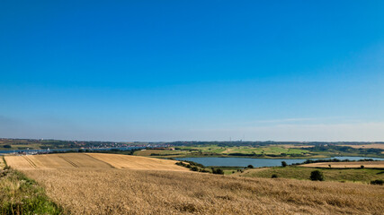 Fototapeta na wymiar rural landscape with a river and blue sky