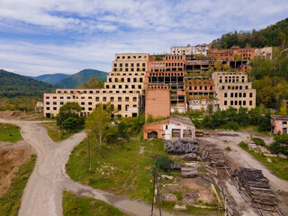 View from above. Ruined and abandoned buildings of a tin mining factory in the village of...