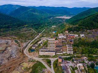 View from above. Ruined and abandoned buildings of a tin mining factory in the village of Kavalerovo. Khrustalnensky ore mining and processing plant