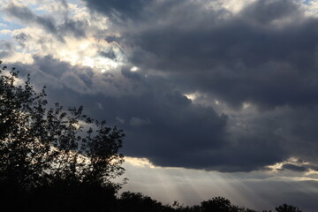 sun rays through thick clouds