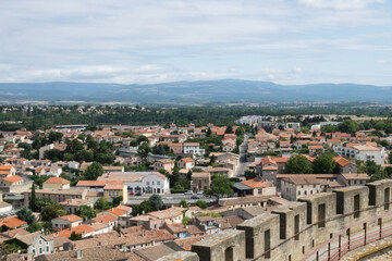 Fototapeta na wymiar The roofs of historic downtown of Carcassone, France and the medieval castle - Cité de Carcassonne