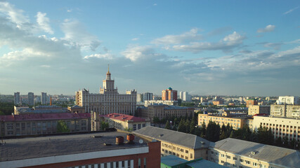 Obraz premium Chelyabinsk cityscape at summer time with a view to South Ural State University and soviete buildings roofs and blue sky with clouds