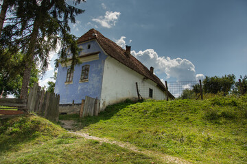 Fototapeta na wymiar houses painted in blue in Roadeș, Brașov Romania 2019