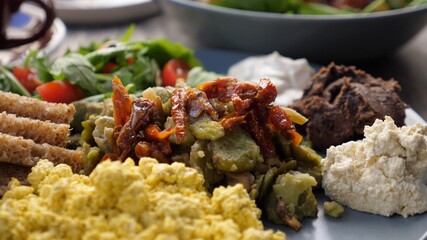 Close up of healthy organic vegan breakfast of full English and salad. Balanced vegan diet