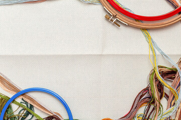 Embroidery frames, embroidery stitching kit with color threads and canvas background with copy space