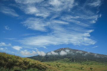 Fototapeta na wymiar Blue sky white clouds above Mount Rinjani