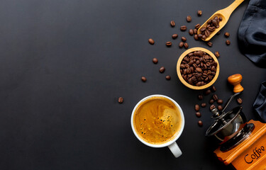 cup of coffee and bean on black background. top view