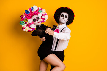Portrait of his he her she glamorous trendy couple celebrating catrina festival having fun dancing passionate move tango isolated bright vivid shine vibrant yellow color background