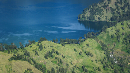 Naklejka na ściany i meble Blue Lake Segara Anak, Mount Rinjani, in bird's eye view