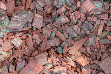 background of many red wood chips, splinters close up