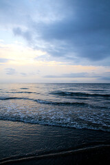 Fototapeta premium the vertical sunset of the sea