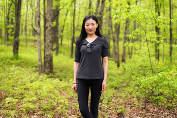 chinese woman on a forest hike