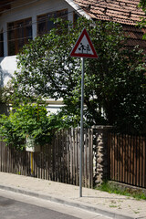 , mother and child, triangular traffic indicator  in Sovata Romania,2020