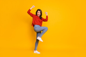 Fototapeta na wymiar Full length body size view of her she nice attractive ecstatic cheerful cheery wavy-haired girl dancing rejoicing celebrating attainment isolated on bright vivid shine vibrant yellow color background