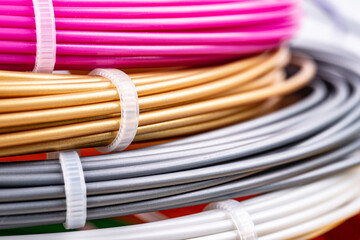Closeup view of rolled wires for filament plastic for 3D printing pen