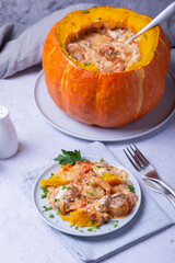 Pumpkin stuffed with shrimps and cheese, whole baked. Traditional Brazilian dish. Close-up.