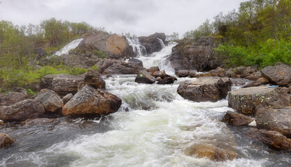 waterfall against the gray sky