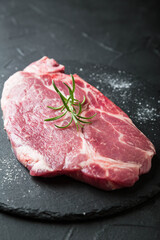 Fresh marbled beef steak on dark background
