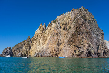 Fototapeta na wymiar View of the rocky coast in Palmarola island (Ponza, Latina, Italy).