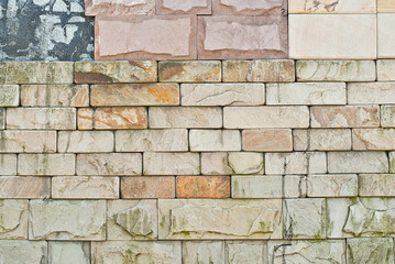 Texture of brick wall. new brickwork. Samples of wall or fence are presented at exhibitions. Yellow brick close up.