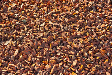 Drainage systems from small pebbles. Garden drainage for plants and trees. Red stones for roads and flower beds.