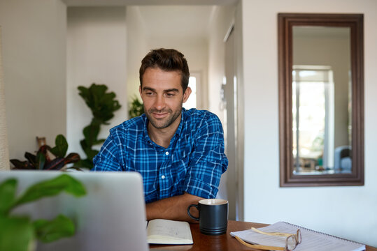 Young man working from home using a laptop