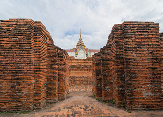 Old ruins of a temple in Phra Nakhon Si Ayutthaya province near Bangkok, Thailand. An old buddha...