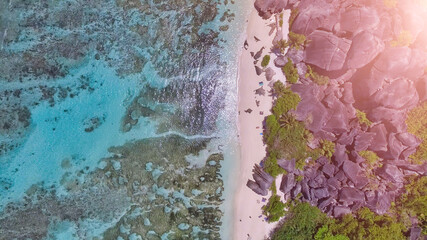 Overhead aerial view of Anse Source Argent in La Digue, Seychelles from drone