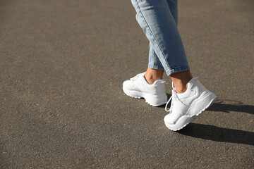 Woman walking outdoors, closeup with space for text. Choosing way concept.