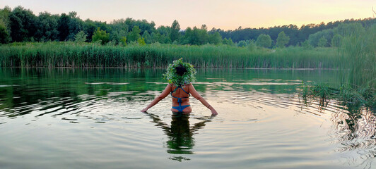 girl in the water on the holiday of Ivan Kupala