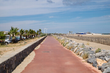 The beautiful seascape - the magnificent view of the seashore, coast of the Mediterranean sea and the lonely beach with wooden cottage in the seaside resort of Gruissan, France