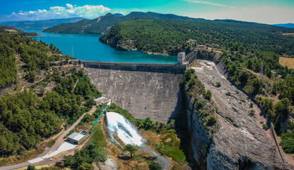 Panorama picture of a dam of hydroelectric power plant of Talarn, on the Talarn lake, close to the Tremp city in Catalunya, Spain on a sunny day.