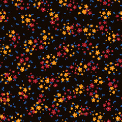 Liberty pattern. Vector seamless texture with small red, yellow flowers and blue leaves on black backdrop. Elegant floral background. Simple ditsy pattern. Repeatable design for decor, fabric, print
