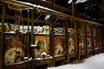 Fototapeta na wymiar Row of disintegrating brick ovens at the abandoned Don Valley Brickworks plant Toronto