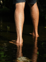 view of the back of ones foot in the water
