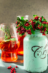 Freshly picked mountain cranberries in a creative jar