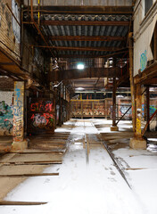 Fototapeta na wymiar Rail lines and snow at the abandoned Don Valley Brickworks plant Toronto