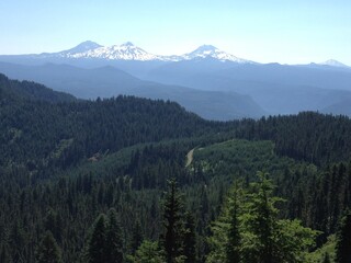 mountain range blue sky forest