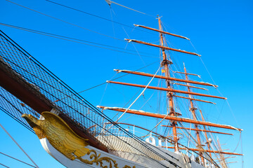Fototapeta premium Tall masts and yards of a white classic sailing vessel.