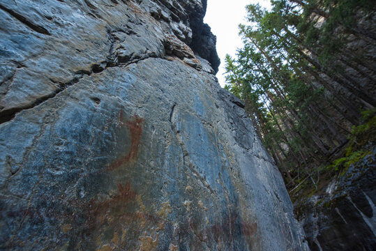 Ancient Indigenous pictographs on a canyon wall, Grotto Canyon, Alberta, Canada
