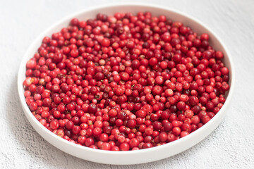 Ripe fresh lingonberry in a white plate scandinavian style