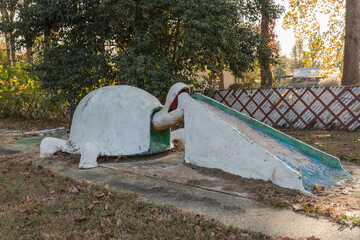 Abandoned miniature golf feature rotting away in the deep south