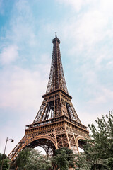 The famous, iconic French landmark, the Eiffel Tower, a popular tourist attraction in Paris.