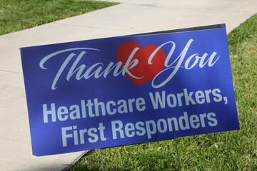 "Thank You Healthcare Workers, First Responders" Sign in the Grass Next to the Emergency Room of a Hospital during the Coronavirus Pandemic